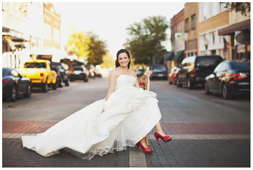 Bridal photo portrait session of Hannah Petkovsik with red high heels shoes in historic downtown McKinney Texas by Dallas wedding photographer Stacy Reeves