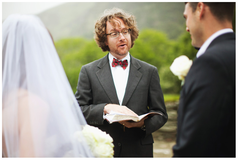 pastor wearing a bow tie during an elopement at the destination wedding of Erin Mazur and Tyler Hufstetler in Dublin Ireland by Dallas wedding photographer Stacy Reeves