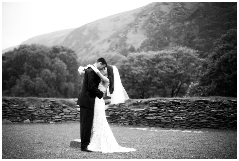 bride and groom in ancient druid stone circle in Wicklow Mountains near Dublin Ireland after eloping