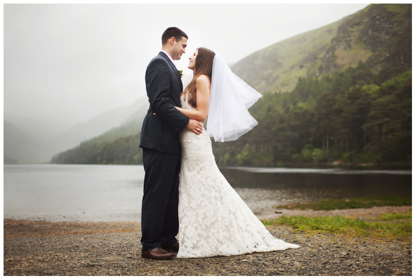 portraits of bride and groom in the wind and rain after wedding day ceremony in the Irish mountains by Stacy Reeves