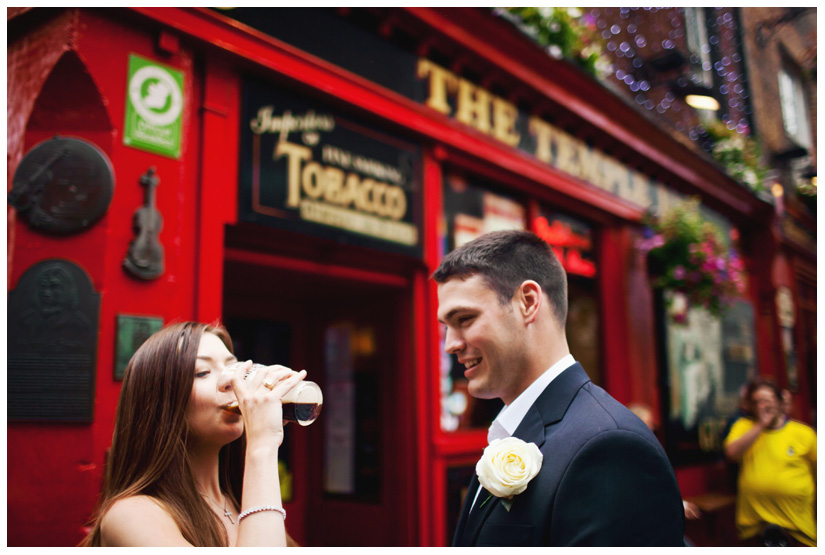 bride drinking Guinness at her wedding in Dublin Ireland